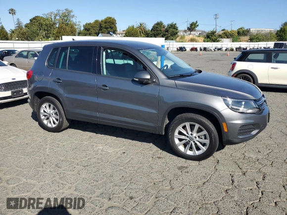 2014 Volkswagen Tiguan SEL with VIN WVGAV3AX8EW585929, listed as a Copart auction lot 61462205 with 63,899 mi miles and Salvage title. Bid and sale history available at DreamBid. Image 4.