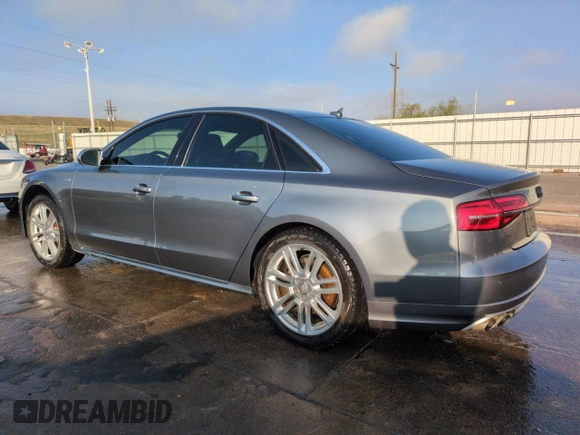 2015 Audi S8 с VIN WAUK2AFDXFN017156, выставлен на аукционе Copart как лот 50602605 с пробегом 100 224 миль миль и Списание • Salvage title. История ставок и продаж доступна на DreamBid. Изображение 2.