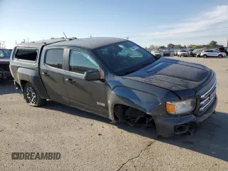 2017 GMC Canyon z VIN 1GTP6CE1XH1252005, wystawiony jako Copart lot #74982794 z przebiegiem 62 797 mil mil oraz Szkoda całkowita • Salvage title. Historia ofert i sprzedaży dostępna na DreamBid. Obrazek 4.