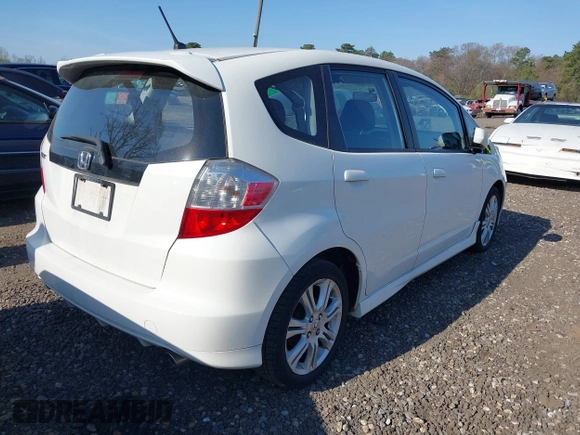 2009 Honda Fit Sport w/Navi with VIN JHMGE88609C002848, listed as a IAAI auction lot 42121403 with 168,138 mi miles. Bid and sale history available at carsss.com. Image 4.