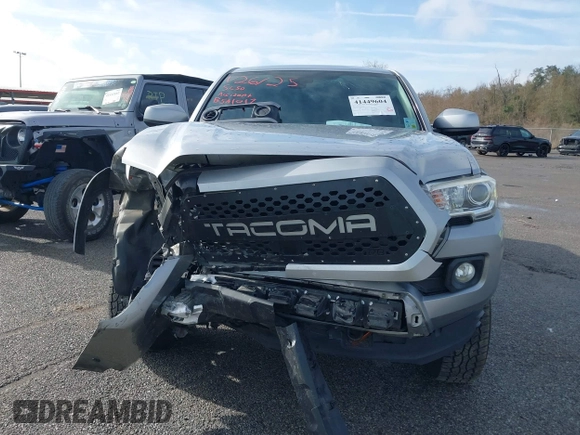 2018 Toyota Tacoma SR5 with VIN 5TFAZ5CN6JX057889, listed as a IAAI auction lot 41449604 with 114,888 mi miles and . Bid and sale history available at DreamBid. Image 12.