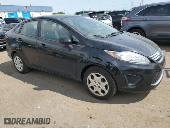 2012 Ford Fiesta SE with VIN 3FADP4BJ3CM118089, listed as a Copart auction lot 68630084 with 49,010 mi miles and Salvage Title. Bid and sale history available at DreamBid. Image 4.