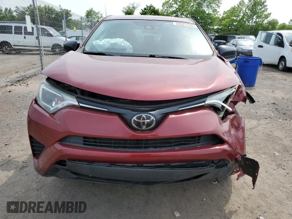 2018 Toyota RAV4 LE with VIN JTMBFREV2JD233808, listed as a Copart auction lot 59021235 with 71,430 mi miles and Salvage title. Bid and sale history available at DreamBid. Image 5.