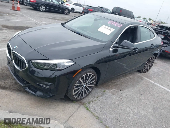 2021 BMW 2 Series 228i with VIN WBA53AK04M7H59327, listed as a IAAI auction lot 41879591 with 13,855 mi miles. Bid and sale history available at carsss.com. Image 2.