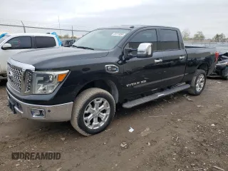 2016 Nissan Titan XD Platinum Reserve with VIN 1N6BA1F29GN512094, listed as a Copart auction lot 84119894 with 121,893 mi miles and Clean Title. Bid and sale history available at carsss.com. Image 1.