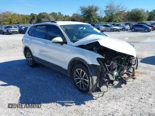 2021 Volkswagen Tiguan S with VIN 3VV1B7AX9MM056025, listed as a IAAI auction lot 41352521 with 98,944 mi miles and . Bid and sale history available at DreamBid. Image 1.