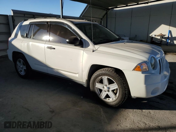 2009 Jeep Compass North with VIN 1J4FT47B79D160392, listed as a Copart auction lot 87213674 with 79,625 mi miles and Salvage Title. Bid and sale history available at carsss.com. Image 4.