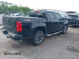 2021 Chevrolet Colorado 4WD Z71 with VIN 1GCGTDEN5M1190797, listed as a IAAI auction lot 42473079 with 77,290 mi miles and . Bid and sale history available at DreamBid. Image 4.