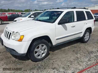 2010 Jeep Grand Cherokee Laredo with VIN 1J4PR4GK0AC151711, listed as a IAAI auction lot 41940295 with 185,684 mi miles. Bid and sale history available at carsss.com. Image 2.