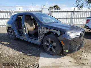 2023 BMW iX xDrive50 with VIN WB523CF02PCM92379, listed as a Copart auction lot 47726814 with 7,721 mi miles. Bid and sale history available at carsss.com. Image 4.