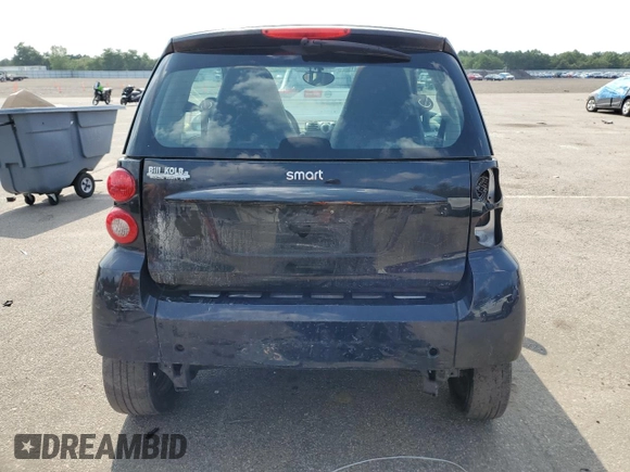 2008 Smart fortwo Pure z VIN WMEEJ31X78K205574, wystawiony jako Copart lot #67711894 z przebiegiem Nie podano mil oraz Tytuł czysty. Historia ofert i sprzedaży dostępna na DreamBid. Obrazek 6.