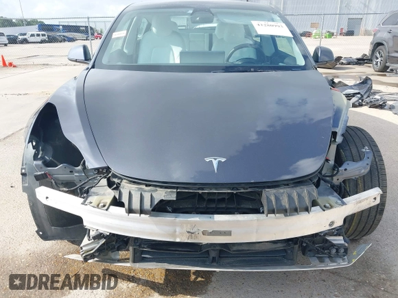 2023 Tesla Model 3 with VIN 5YJ3E1EA7PF567906, listed as a IAAI auction lot 42280993 with 41,452 mi miles and . Bid and sale history available at DreamBid. Image 6.