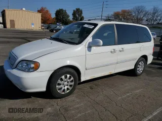 2005 Kia Sedona LX with VIN KNDUP132056685525, listed as a Copart auction lot 77790354 with 60,985 mi miles and Salvage Title. Bid and sale history available at carsss.com. Image 1.