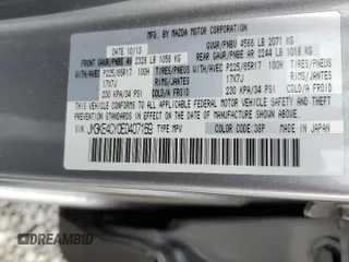 2014 Mazda CX-5 Touring z VIN JM3KE4CY0E0407169, wystawiony jako Copart lot #57877215 z przebiegiem 168 277 mil mil oraz Szkoda całkowita • Salvage title. Historia ofert i sprzedaży dostępna na DreamBid. Obrazek 13.