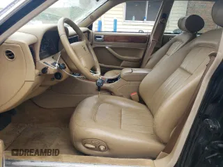 1997 Jaguar XJ with VIN SAJHX6248VC806189, listed as a Copart auction lot 57891035 with 51,654 mi miles and Salvage title. Bid and sale history available at DreamBid. Image 7.