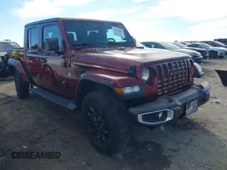 2021 Jeep Gladiator Sport z VIN 1C6JJTAGXML611387, wystawiony jako IAAI lot #41656881 z przebiegiem 65 505 mil mil oraz . Historia ofert i sprzedaży dostępna na DreamBid. Obrazek 1.