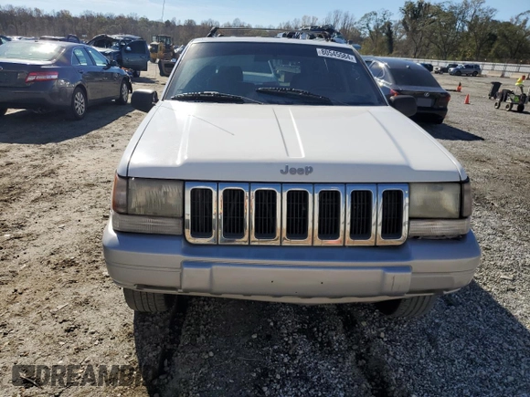 1996 Jeep Grand Cherokee Laredo with VIN 1J4FX58SXTC349575, listed as a Copart auction lot 80545584 with 302,636 mi miles and Salvage Title. Bid and sale history available at carsss.com. Image 5.