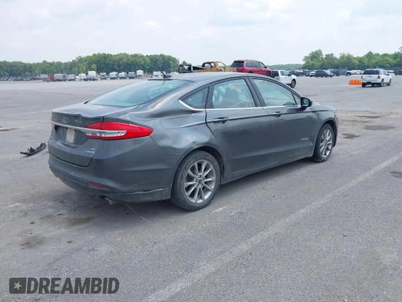 2017 Ford Fusion Hybrid SE with VIN 3FA6P0LUXHR279771, listed as a IAAI auction lot 42417831 with 189,493 mi miles and . Bid and sale history available at DreamBid. Image 4.