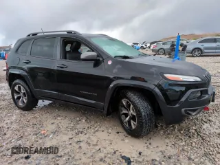 2014 Jeep Cherokee Trailhawk with VIN 1C4PJMBS1EW211570, listed as a Copart auction lot 51465845 with 156,320 mi miles and Salvage Title. Bid and sale history available at carsss.com. Image 4.