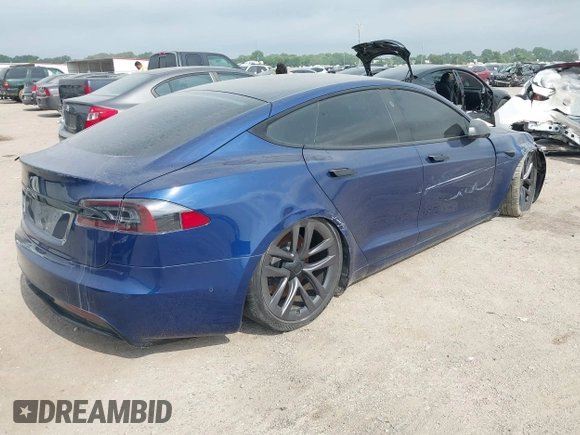 2021 Tesla Model S Plaid with VIN 5YJSA1E64MF442036, listed as a IAAI auction lot 42141304 with 24,998 mi miles and . Bid and sale history available at DreamBid. Image 4.