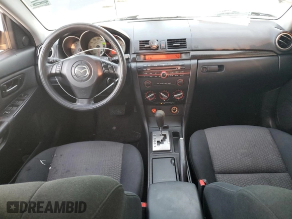 2007 Mazda 3 i Touring with VIN JM1BK32F571676258, listed as a Copart auction lot 87883545 with 141,203 mi miles and Salvage Title. Bid and sale history available at DreamBid. Image 8.