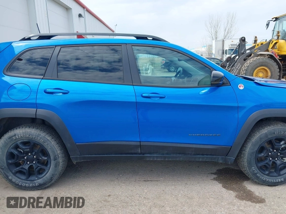 2022 Jeep Cherokee Trailhawk z VIN 1C4PJMBX4ND513488, wystawiony jako IAAI lot #42137114 z przebiegiem 12 306 mil mil oraz . Historia ofert i sprzedaży dostępna na DreamBid. Obrazek 13.
