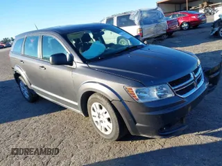 2015 Dodge Journey American Value Pkg with VIN 3C4PDCAB3FT511458, listed as a IAAI auction lot 41214163 with 176,590 mi miles. Bid and sale history available at carsss.com. Image 1.