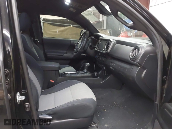 2021 Toyota Tacoma SR with VIN 3TMCZ5AN4MM448304, listed as a IAAI auction lot 42046932 with 56,161 mi miles and . Bid and sale history available at DreamBid. Image 5.