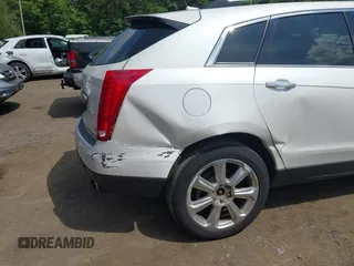 2014 Cadillac SRX Performance Collection with VIN 3GYFNFE34ES677712, listed as a IAAI auction lot 42668059 with 150,135 mi miles and . Bid and sale history available at DreamBid. Image 6.