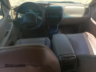 1999 Ford Explorer XLT z VIN 1FMZU32E4XUB76005, wystawiony jako Copart lot #65391564 z przebiegiem 245 873 mil mil oraz Szkoda całkowita • Salvage title. Historia ofert i sprzedaży dostępna na DreamBid. Obrazek 8.