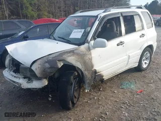 2001 Suzuki Grand Vitara with VIN JS3TE62V214154487, listed as a IAAI auction lot 41116104 with 1 mi miles. Bid and sale history available at carsss.com. Image 2.