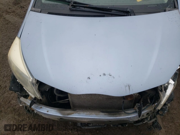 2012 Toyota Yaris L with VIN JTDKTUD33CD517298, listed as a Copart auction lot 52099335 with Not Provided miles and Salvage Title. Bid and sale history available at DreamBid. Image 11.