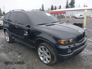 2005 BMW X5 4.8is with VIN 5UXFA93515LE82570, listed as a IAAI auction lot 41759657 with 212,687 mi miles. Bid and sale history available at carsss.com. Image 1.