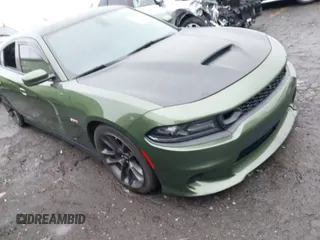 2021 Dodge Charger Scat Pack with VIN 2C3CDXGJ8MH616219, listed as a IAAI auction lot 41394474 with 59,434 mi miles and . Bid and sale history available at DreamBid. Image 1.