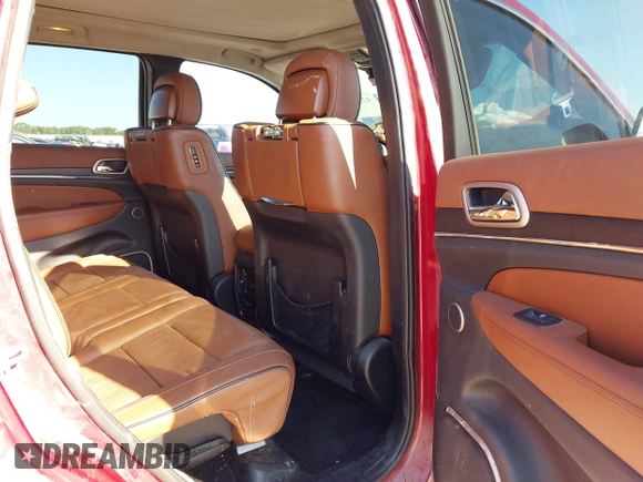 2015 Jeep Grand Cherokee Summit with VIN 1C4RJEJG9FC100568, listed as a IAAI auction lot 42512705 with 128,413 mi miles and . Bid and sale history available at DreamBid. Image 8.