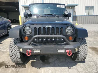 2011 Jeep Wrangler Sahara with VIN 1J4AA5D14BL542912, listed as a Copart auction lot 65158784 with 122,795 mi miles and Salvage Title. Bid and sale history available at DreamBid. Image 5.