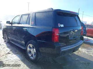 2016 Chevrolet Tahoe LTZ with VIN 1GNSKCKCXGR274864, listed as a IAAI auction lot 41428433 with 117,365 mi miles. Bid and sale history available at carsss.com. Image 3.