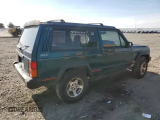 1995 Jeep Cherokee Sport with VIN 1J4FJ67S4SL519629, listed as a Copart auction lot 76107844 with 312,532 mi miles and Salvage Title. Bid and sale history available at carsss.com. Image 3.