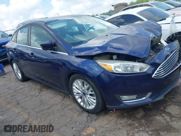 2016 Ford Focus Titanium z VIN 1FADP3J20GL208439, wystawiony jako IAAI lot #42145938 z przebiegiem 135 522 mil mil oraz . Historia ofert i sprzedaży dostępna na DreamBid. Obrazek 1.