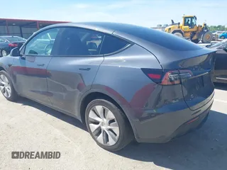 2023 Tesla Model Y Long Range with VIN 7SAYGDEE4PA037218, listed as a IAAI auction lot 42232704 with 18,756 mi miles and . Bid and sale history available at DreamBid. Image 3.