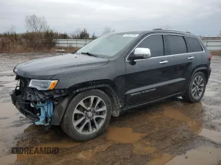 2017 Jeep Grand Cherokee Overland with VIN 1C4RJFCG0HC836448, listed as a Copart auction lot 47053705 with 87,459 mi miles and Salvage Title. Bid and sale history available at carsss.com. Image 1.