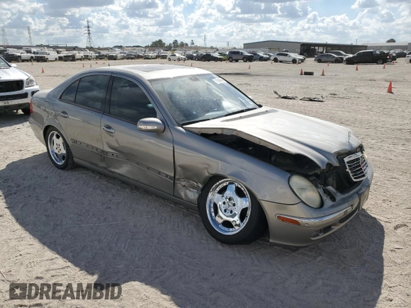 2003 Mercedes-Benz E-Class 5.0L with VIN WDBUF70J73A119596, listed as a Copart auction lot 77382424 with 237,620 mi miles and Salvage Title. Bid and sale history available at carsss.com. Image 4.
