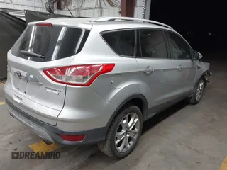 2015 Ford Escape Titanium with VIN 1FMCU0J96FUB81598, listed as a IAAI auction lot 41872114 with 122,001 mi miles and . Bid and sale history available at DreamBid. Image 4.