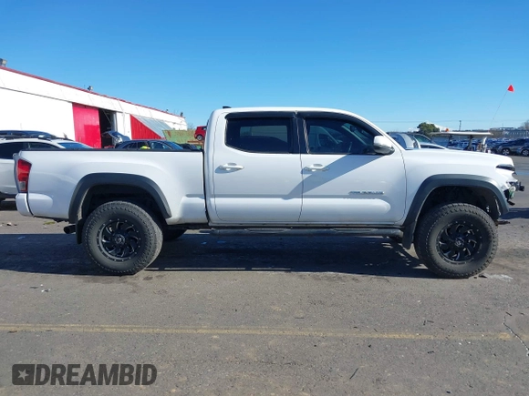 2017 Toyota Tacoma SR5 with VIN 3TMDZ5BN3HM023813, listed as a IAAI auction lot 41522828 with 128,533 mi miles and . Bid and sale history available at DreamBid. Image 14.