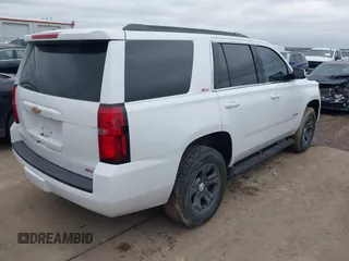 2017 Chevrolet Tahoe LT with VIN 1GNSKBKC1HR401044, listed as a IAAI auction lot 41573362 with 103,865 mi miles and . Bid and sale history available at DreamBid. Image 4.