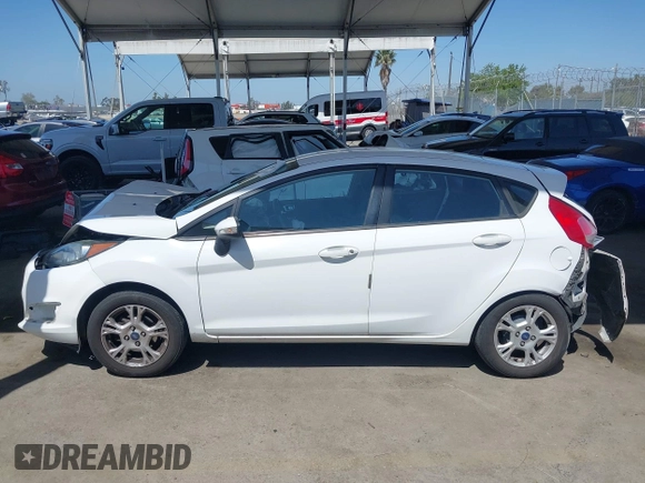 2014 Ford Fiesta SE z VIN 3FADP4EJ4EM117919, wystawiony jako IAAI lot #42262361 z przebiegiem 121 141 mil mil oraz . Historia ofert i sprzedaży dostępna na DreamBid. Obrazek 14.
