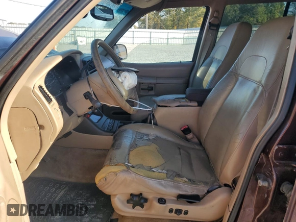 2000 Ford Explorer Eddie Bauer z VIN 1FMDU84P0YZB89831, wystawiony jako Copart lot #77874224 z przebiegiem 209 532 mil mil oraz Szkoda całkowita • Salvage title. Historia ofert i sprzedaży dostępna na DreamBid. Obrazek 7.