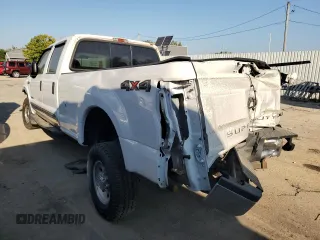 2000 Ford F-350 XL with VIN 1FTSW31F7YED79895, listed as a Copart auction lot 71744804 with 176,241 mi miles and Salvage Title. Bid and sale history available at DreamBid. Image 2.