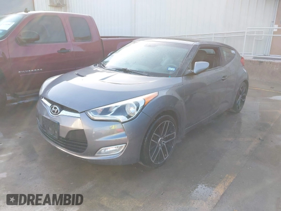 2013 Hyundai Veloster w/Black Int with VIN KMHTC6AD2DU158889, listed as a IAAI auction lot 41878065 with 157,450 mi miles and . Bid and sale history available at DreamBid. Image 2.