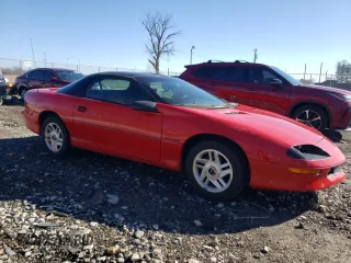 1994 Chevrolet Camaro z VIN 2G1FP22SXR2165249, wystawiony jako Copart lot #49333055 z przebiegiem 196 736 mil mil oraz Czysty tytuł • Clean title. Historia ofert i sprzedaży dostępna na DreamBid. Obrazek 4.